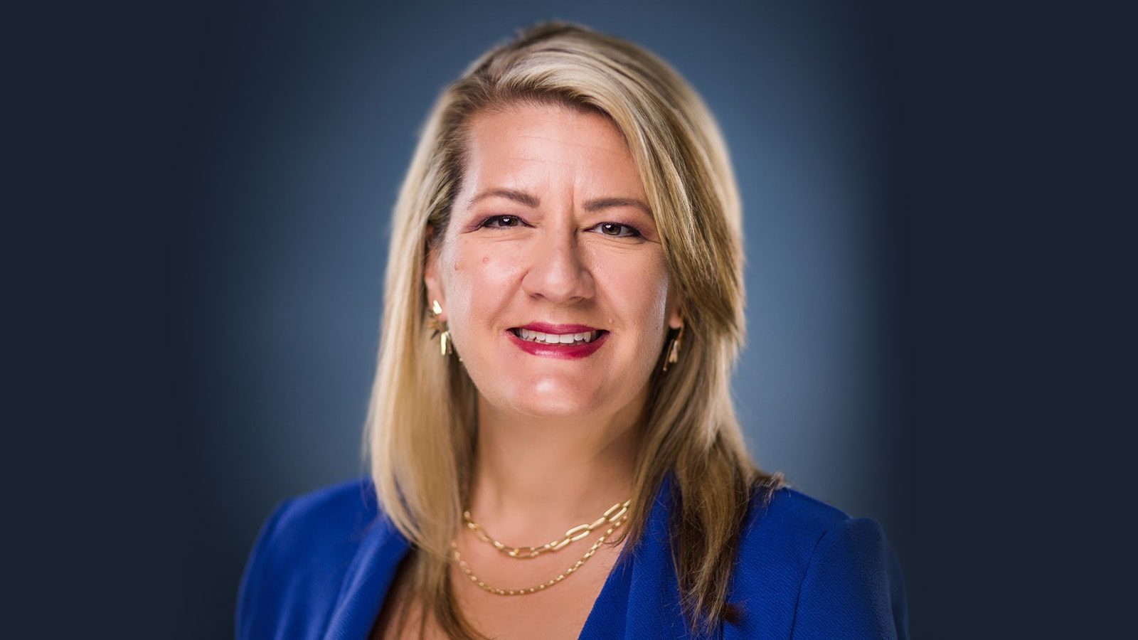 Headshot of Dr. Heather Dartez smiling, wearing a blue blazer.