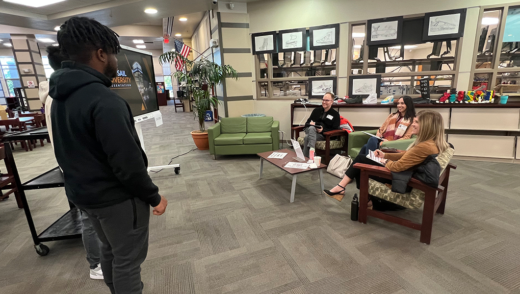 Faculty Coaches Junior Achievement Learning Experience for Local High School - Hero image