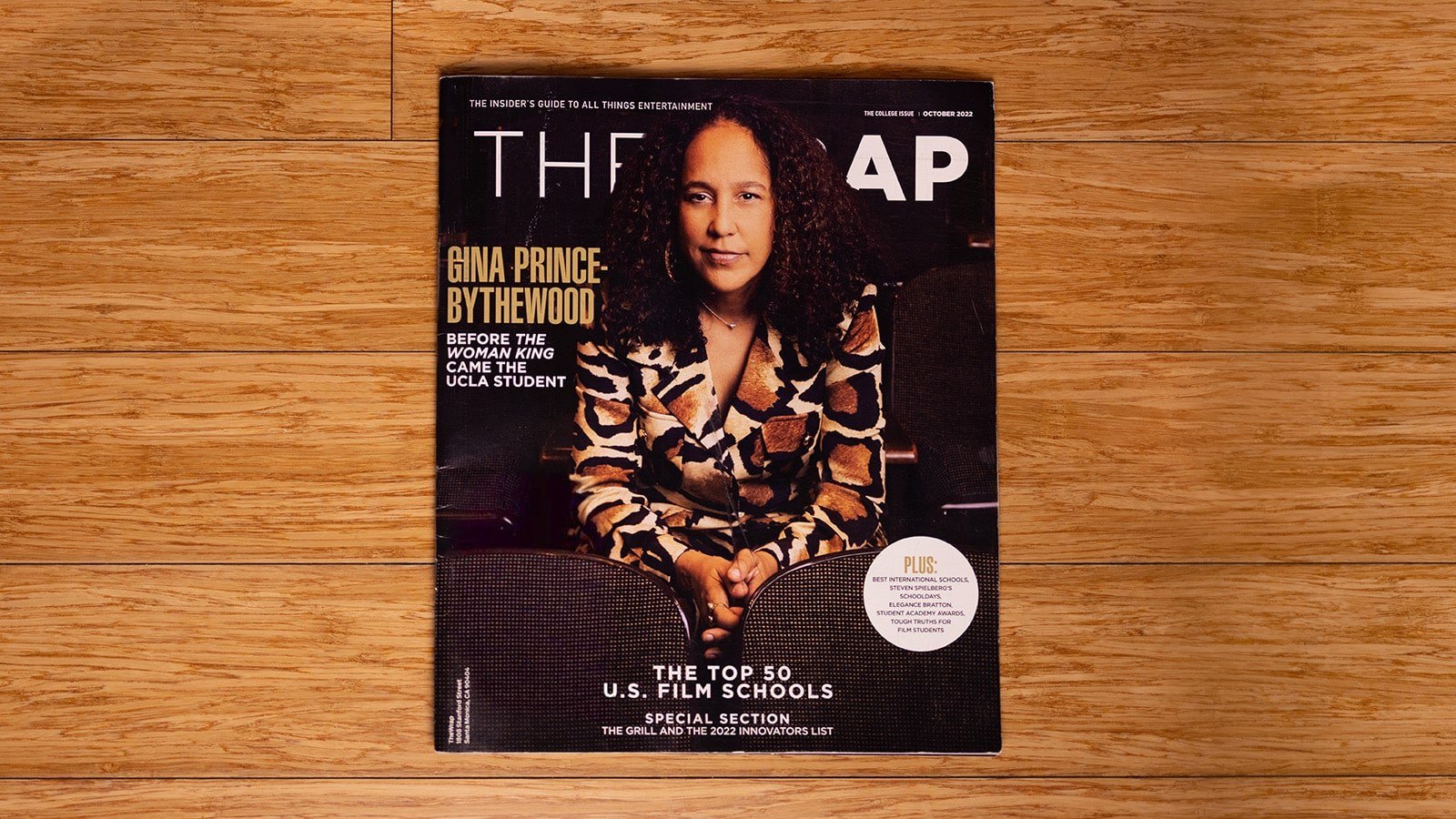 A bird’s eye view of the The Wrap issue. The magazine cover is a picture of Gina Prince-Bythewood, a women with brown hair wearing a brown and beige blazer.