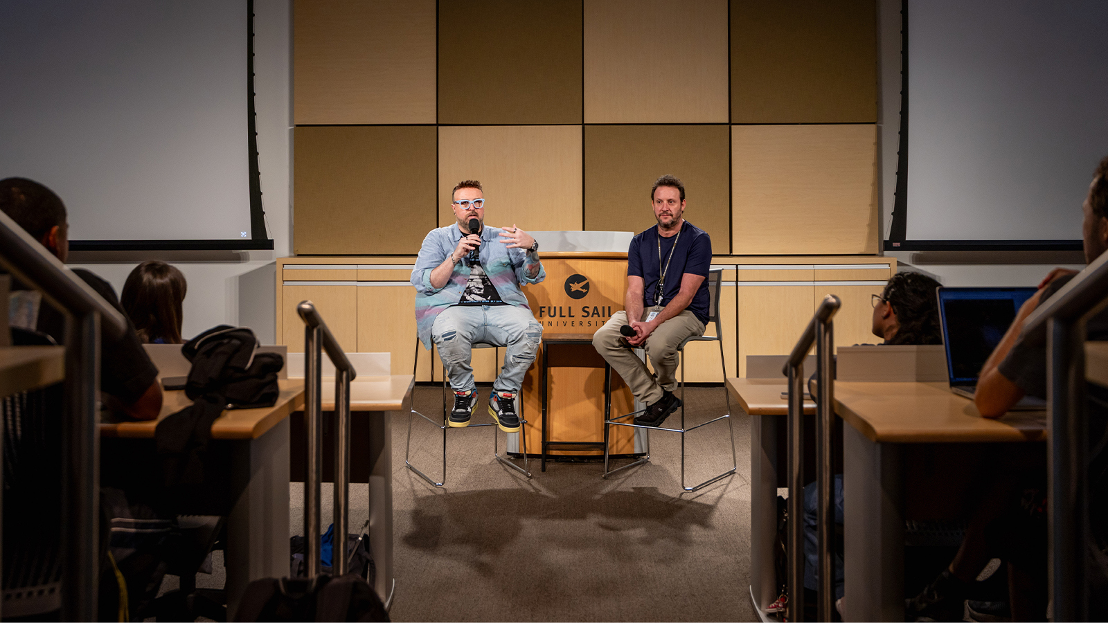 Aaron B. Koontz and Larry Katz lead a Q&A in Full Sail's EB Auditorium, speaking to students about film and television production.