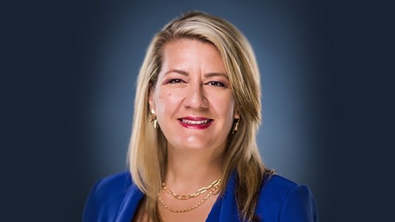 Headshot of Dr. Heather Dartez smiling, wearing a blue blazer.