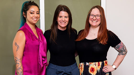 Three women from Full Sail nominated at this year’s *gamehers Awards are seen standing together and smiling at the camera.