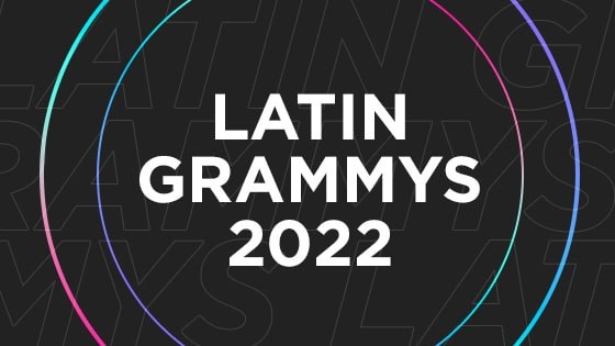 A black graphic with Latin Grammys 2022 written in white surrounded by two multicolored circles.