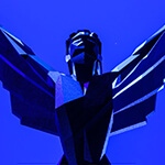 A graphic with a blue background and a Game Awards trophy sitting on a pedestal. The words “The Game Awards December 9” are overlaid in white.