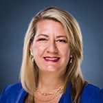 Headshot of Dr. Heather Dartez smiling, wearing a blue blazer.