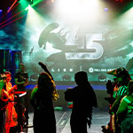 A vibrant crowd in costumes gathers at Full Sail University, celebrating 45 years of the ‘Alien’ franchise for Halloween.