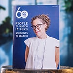 The February 2023 print edition of ‘Graphic Design USA.’ The cover features a smiling designer and text saying “People to Watch in 2023: Students to Watch.”