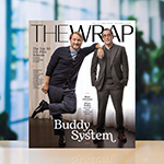 Two men wearing suits stand next to each other on the October 2025 cover of TheWrap magazine. The headline “Top 50 US Film Schools” is next to them.