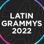 A black graphic with Latin Grammys 2022 written in white surrounded by two multicolored circles.