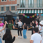 A group dancing at the Latin Music Festival hosted at the Full Sail Backlot.