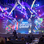 NBA 2K League CEO Andrew Perlmutter on stage in front of a large screen featuring the NBA 2K League Draft logo.