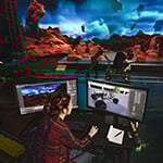 A production crew films on a sci-fi virtual set while a technician controls digital environments on monitors.
