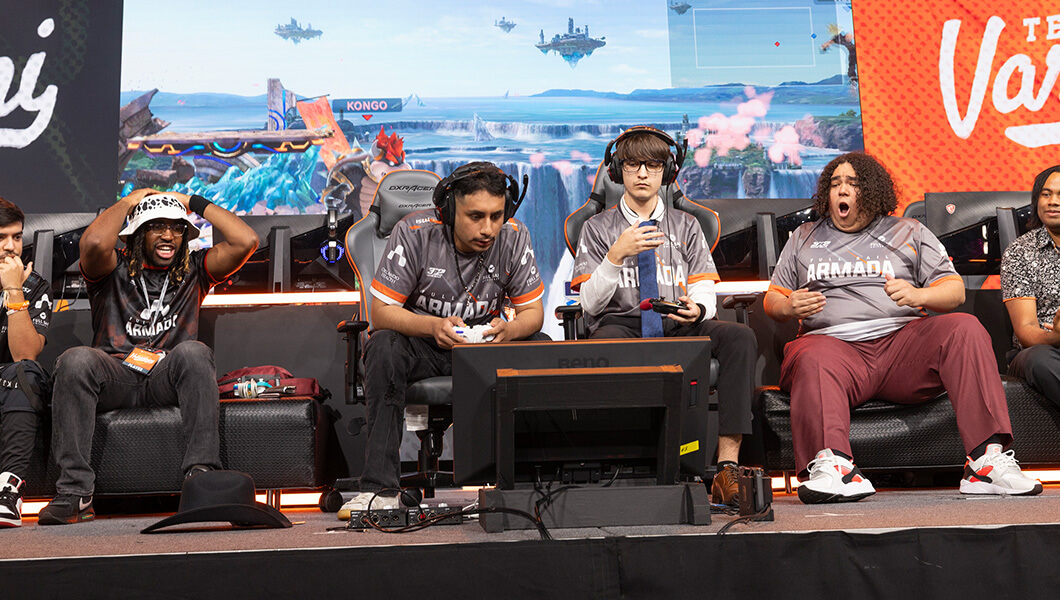 Armada varsity players and alumni on stage playing Super Smash Bros. during Hall of Game.