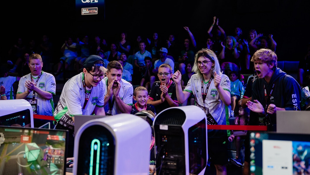 XP League coaches and players cheer during a 'Valorant' match.