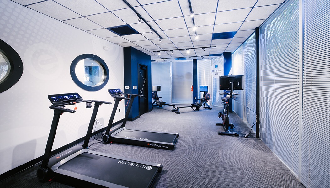 Equipment from Echelon including two treadmills, two rowing machines, and an exercise bike in the Fitness Technology Lab.