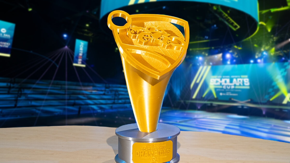 Gold High School Esports Scholar's Cup Champions first place trophy featuring 'Rocket League' logo.