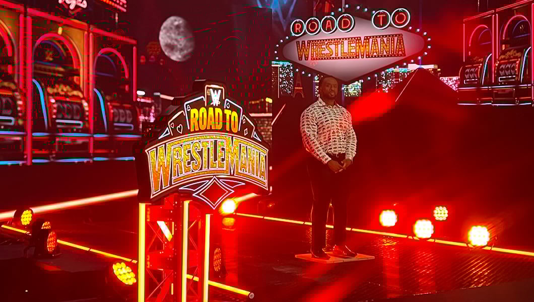 WWE Superstar Big E records content at Studio V1 with ‘Road to WrestleMania’ signage, lights, and a Las Vegas-themed backdrop.